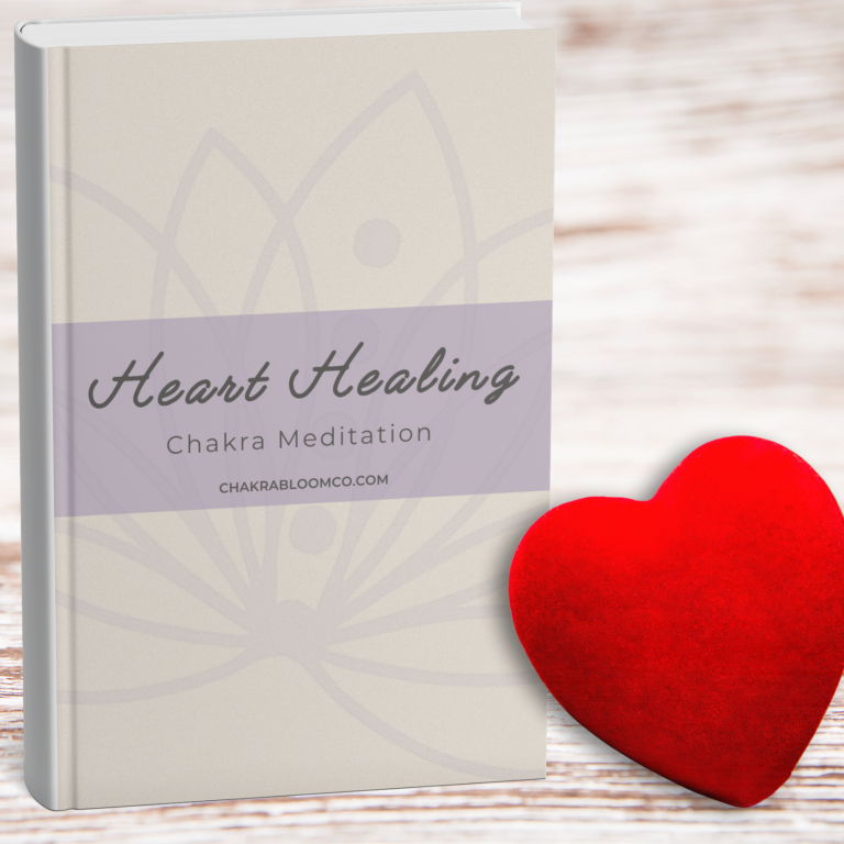 Book titled "Heart Healing" on chakra meditation next to a red heart shape.